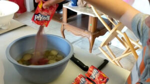 pouring in kool aid