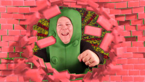 Koolickle Man bursts through wall