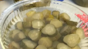 topping off pickles with water
