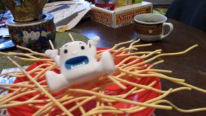 closeup of yeti balanced on top of the spaghetti