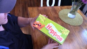 side view of box of hungry hungry hippos on table