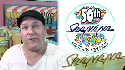 neil dandy with graphic of promotion for sha na na 50th anniversary performance