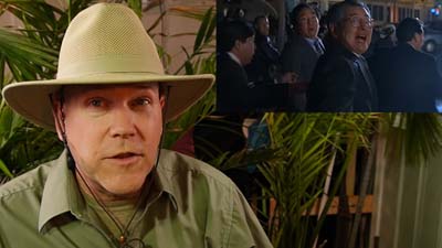 neil dandy with image of japanese tourists running from t-rex in a previous sequel to jurassic park
