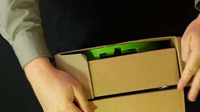 opening the top of ravenous raptors game box