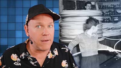 neil dandy with vintage image of a tall stack of hula hoops in the wham-o warehouse