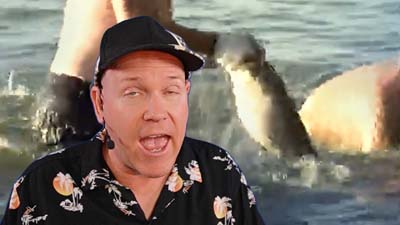 neil dandy with a picture of a man with his fist in a catfish's mouth