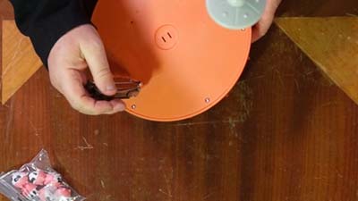 opening the battery compartment with a screwdriver