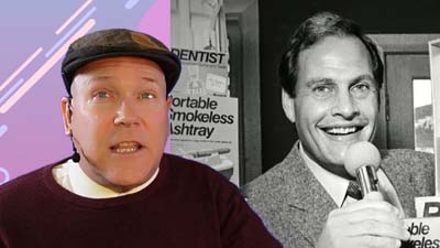 neil dandy with a picture of ron popeil from the 70s holding a mr. microphone to his mouth