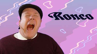 neil dandy with the classic ronco logo with a wavy effect