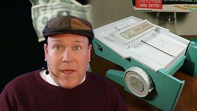 neil dandy with a picture of an early version of the popeil dial-o-matic