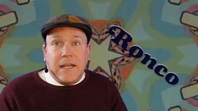 neil dandy with a 60s kaleidoscope background with an early version of the ronco logo