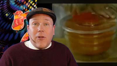 neil dandy with a picture of the ronco salad spinner