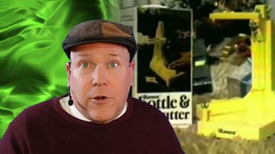 neil dandy with a picture of the ronco bottle and jar cutter