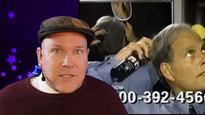 neil dandy with a picture of ron popeil demonstrating his spray-on hair product