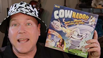 neil dandy holding cownado game box