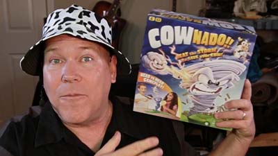 neil dandy holding cownado game box