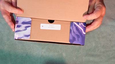 closeup of cownado game box flap being opened