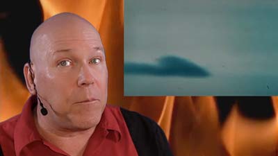 neil dandy with crash footage and fire background