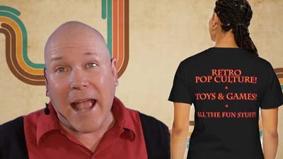 neil dandy with model showing back of dandy fun house t-shirt and retro 70s background