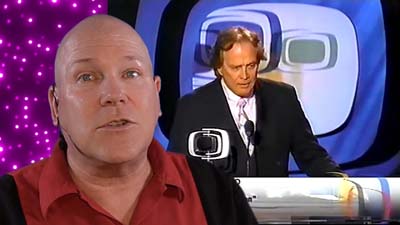neil dandy with picture of lee majors accepting superest superhero award