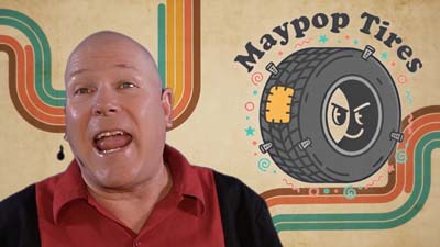 neil dandy with maypop tires logo and retro 70s background