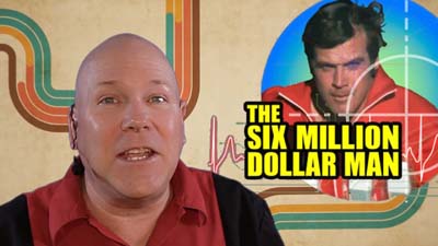 neil dandy with picture of lee majors as six million dollar man