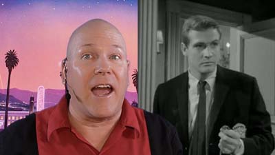 neil dandy with picture of lee majors wearing suit and tie