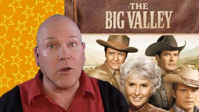 neil dandy with promotional photo of the cast of The Big Valley