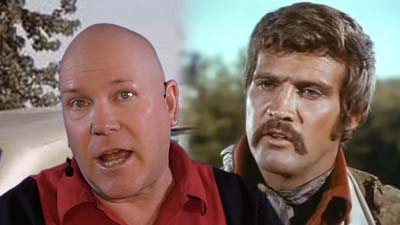 neil dandy with picture of mustached lee majors wearing western garb