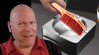 neil dandy with picture of a comb on a metal ashtray